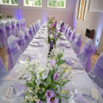 Tables laid out for wedding at East Dean Village Hall