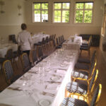 carefully laying the tables at East Dean Village Hall