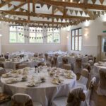 round tables set up for a celebration at East Dean Village Hall