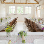 beautiful tables set up for a wedding at East Dean Village Hall